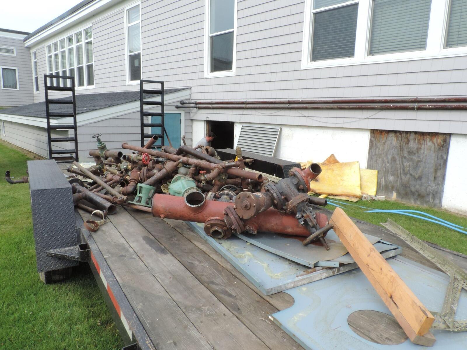 Old parts being hauled away for scrap