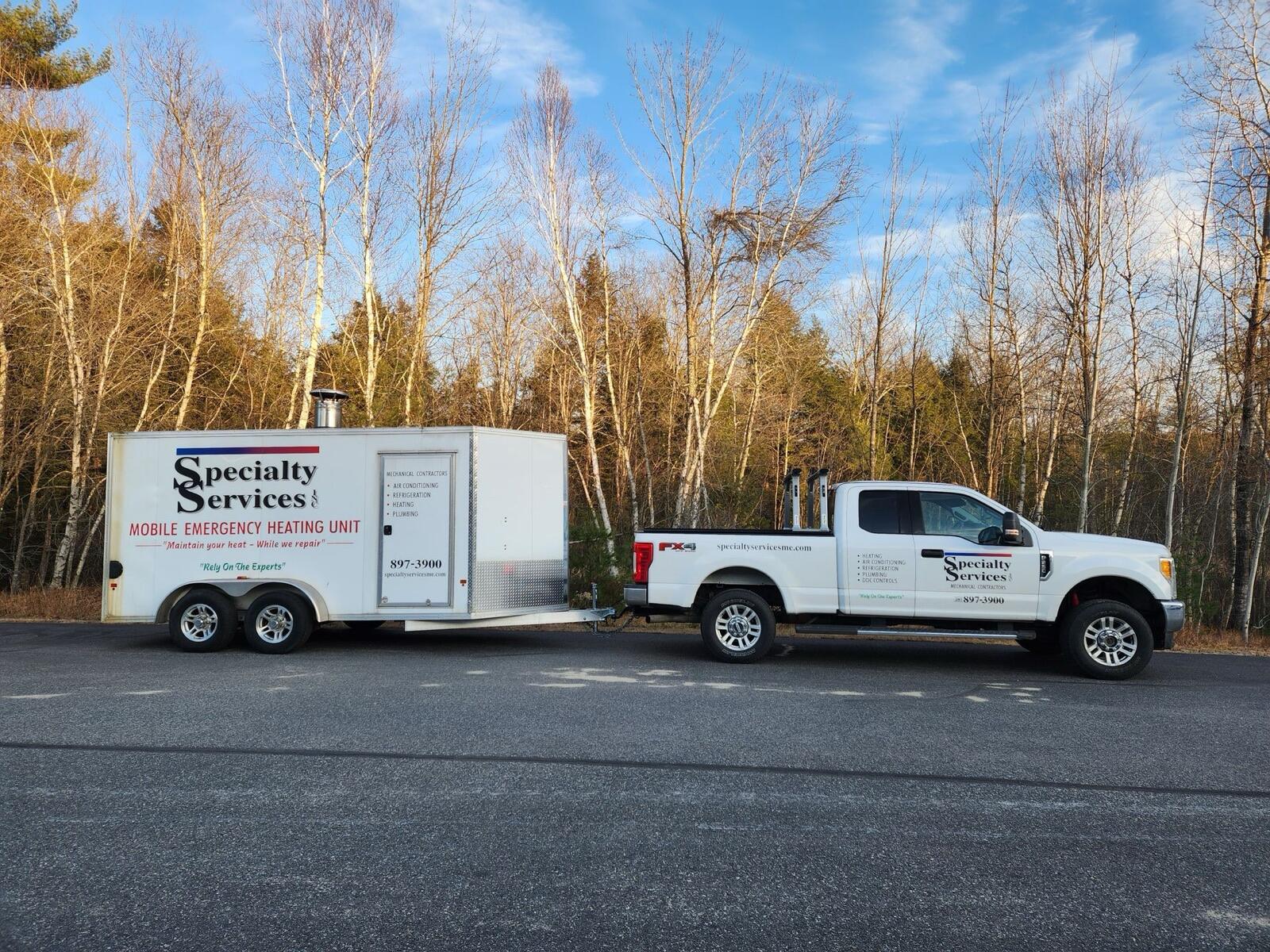 Specialty Services truck towing the mobile emergency heating unit